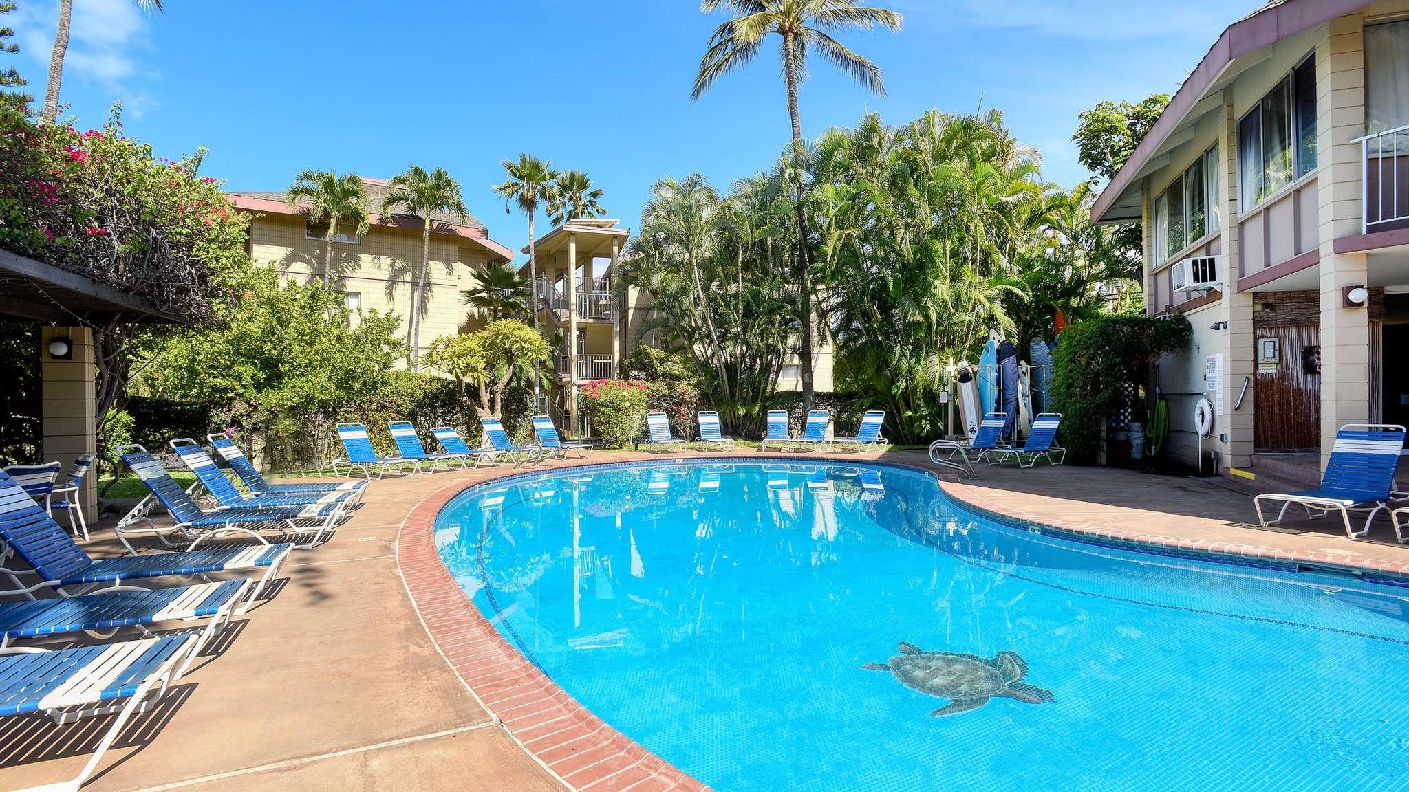2619 South Kihei Road, Unit 309A Kihei, HI 96753 - Photo 25 of 41 a view of a swimming pool with a patio and a yard