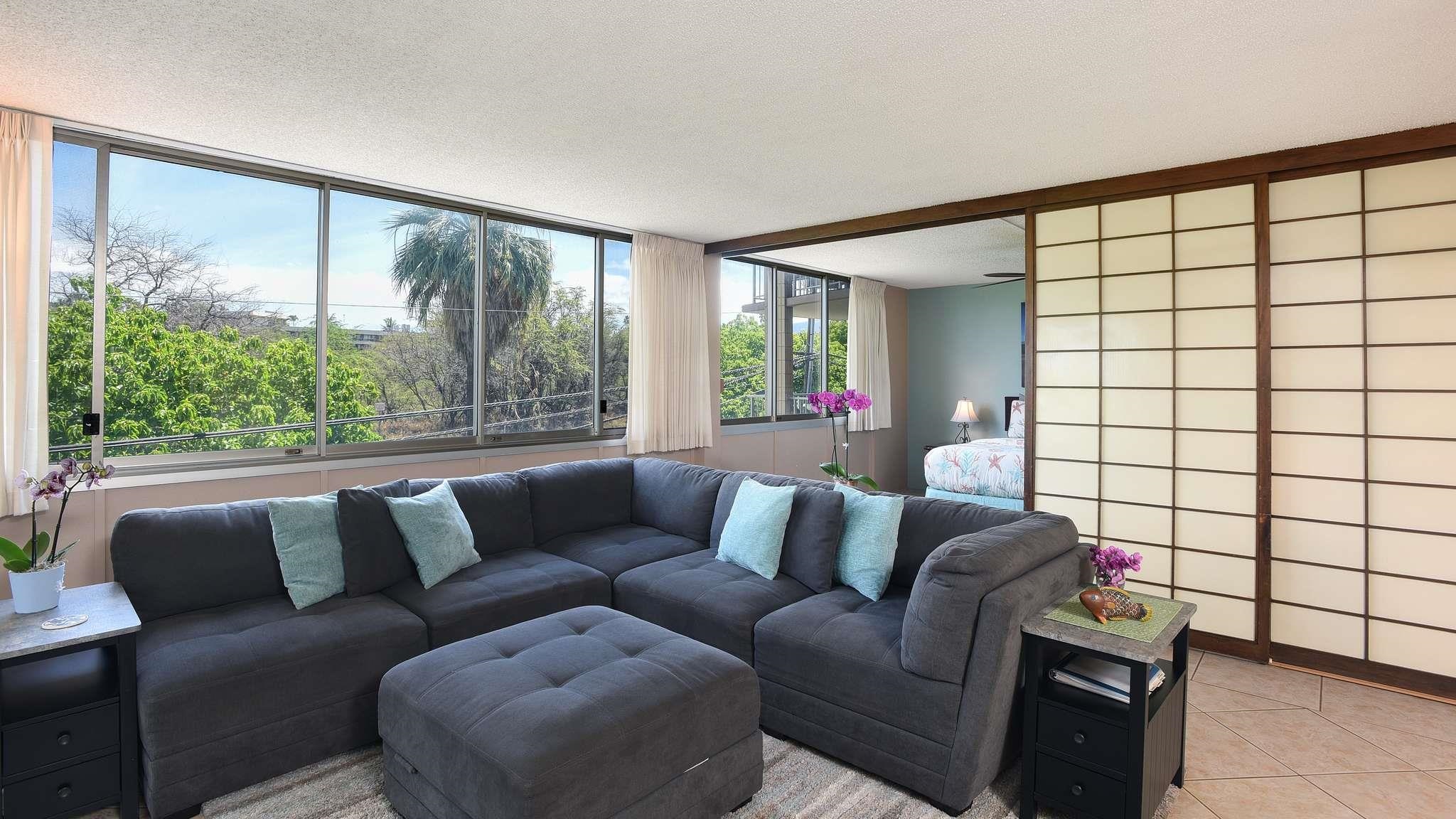2619 South Kihei Road, Unit 309A Kihei, HI 96753 - Photo 9 of 41 a living room with furniture and a large window
