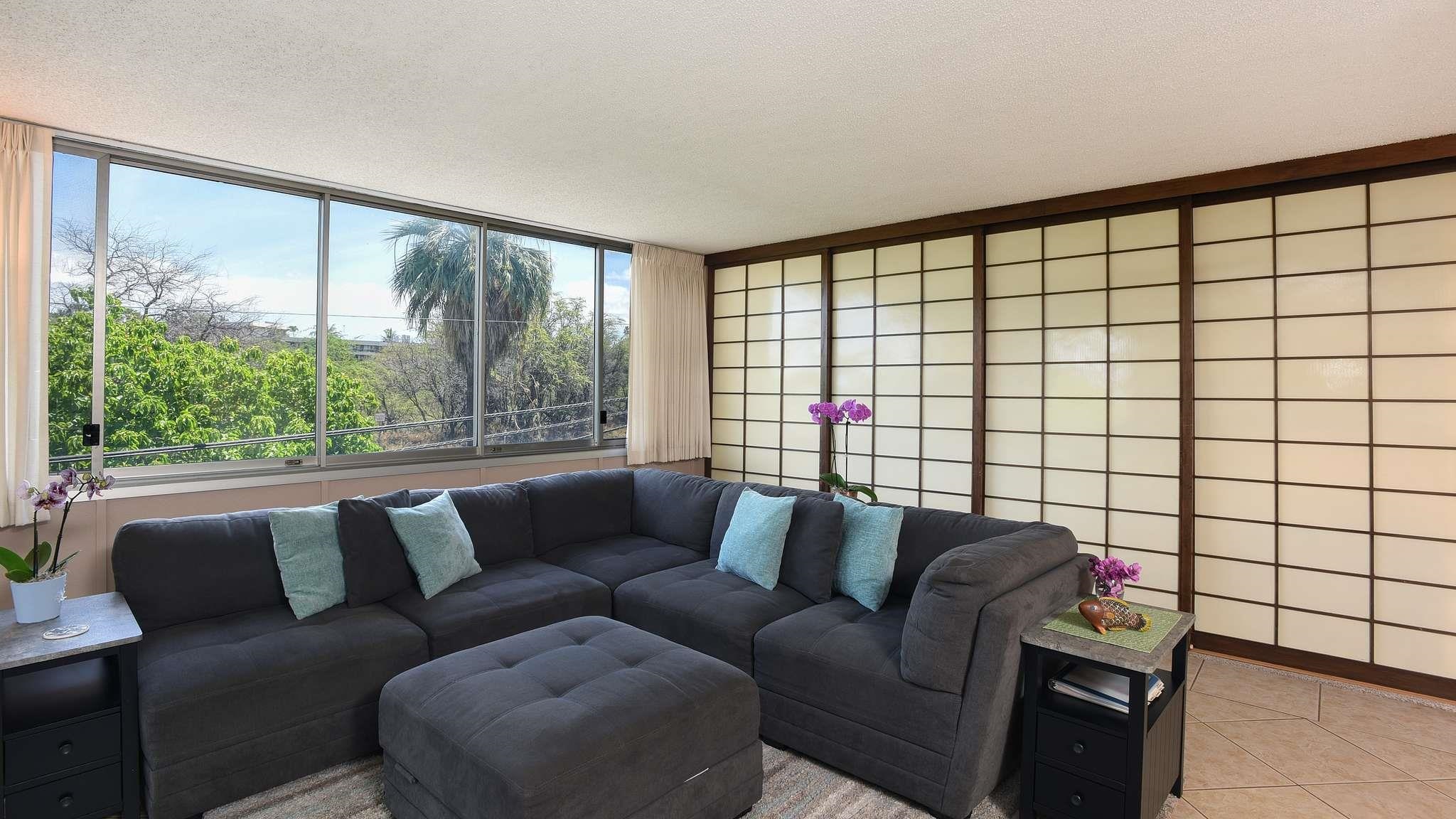 2619 South Kihei Road, Unit 309A Kihei, HI 96753 - Photo 10 of 41 a living room with furniture and a large window