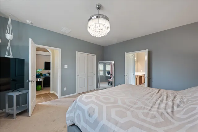 a bedroom with a bed and a television in it