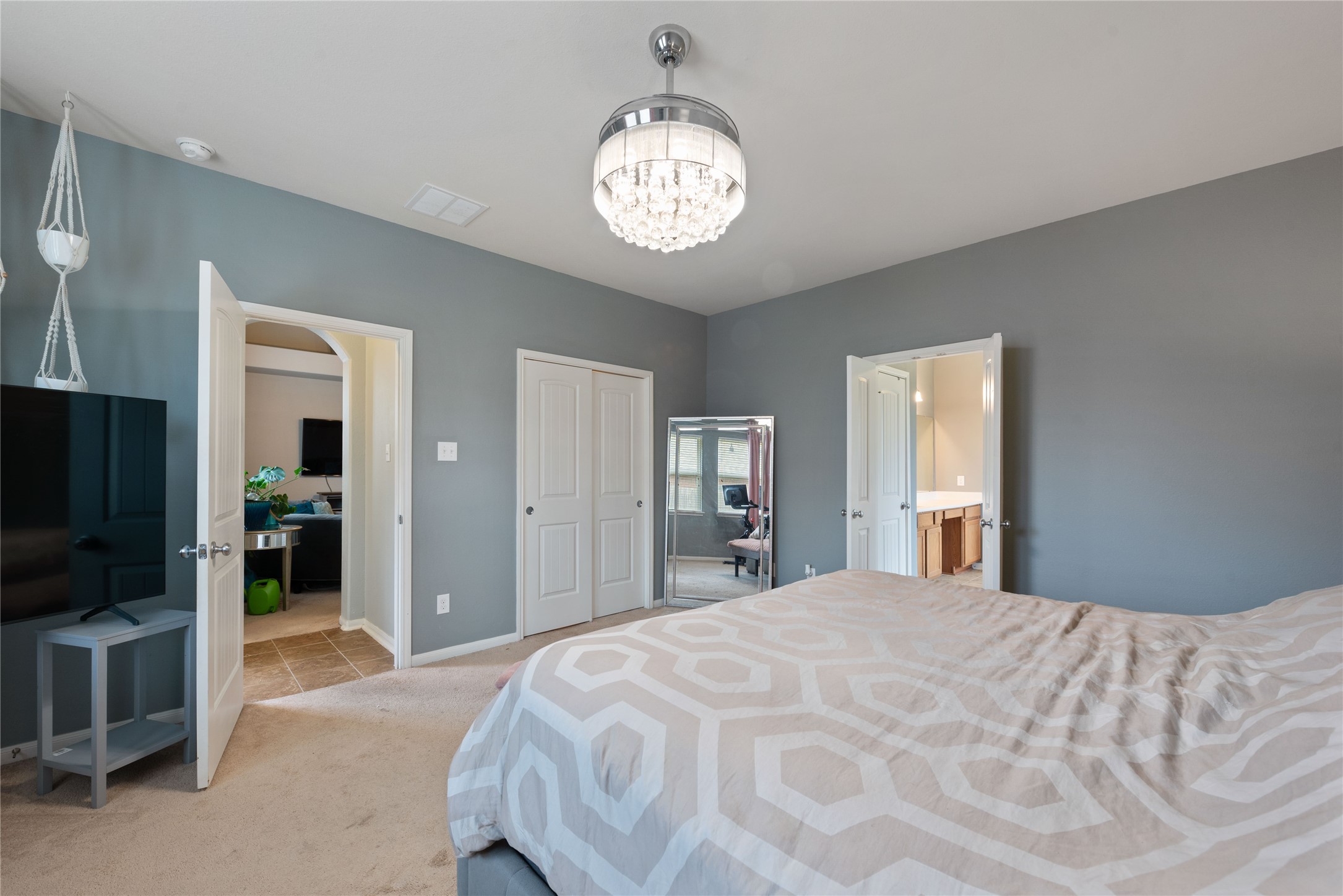 970 Jennifer Street Alvin, TX 77511 - Photo 17 of 27 a bedroom with a bed and a television in it