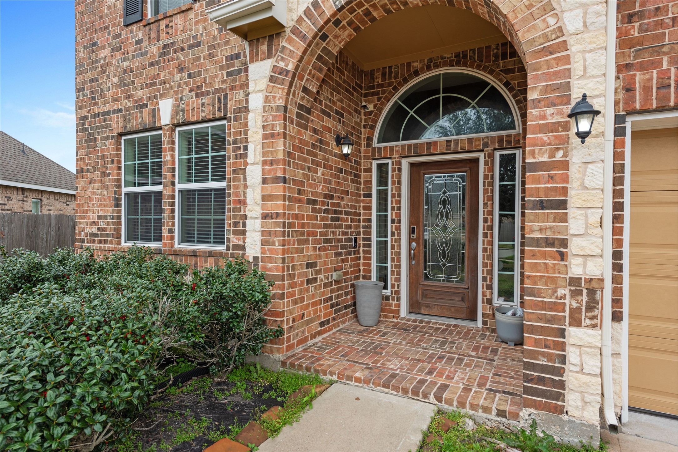 970 Jennifer Street Alvin, TX 77511 - Photo 2 of 27 a front view of a house with a yard