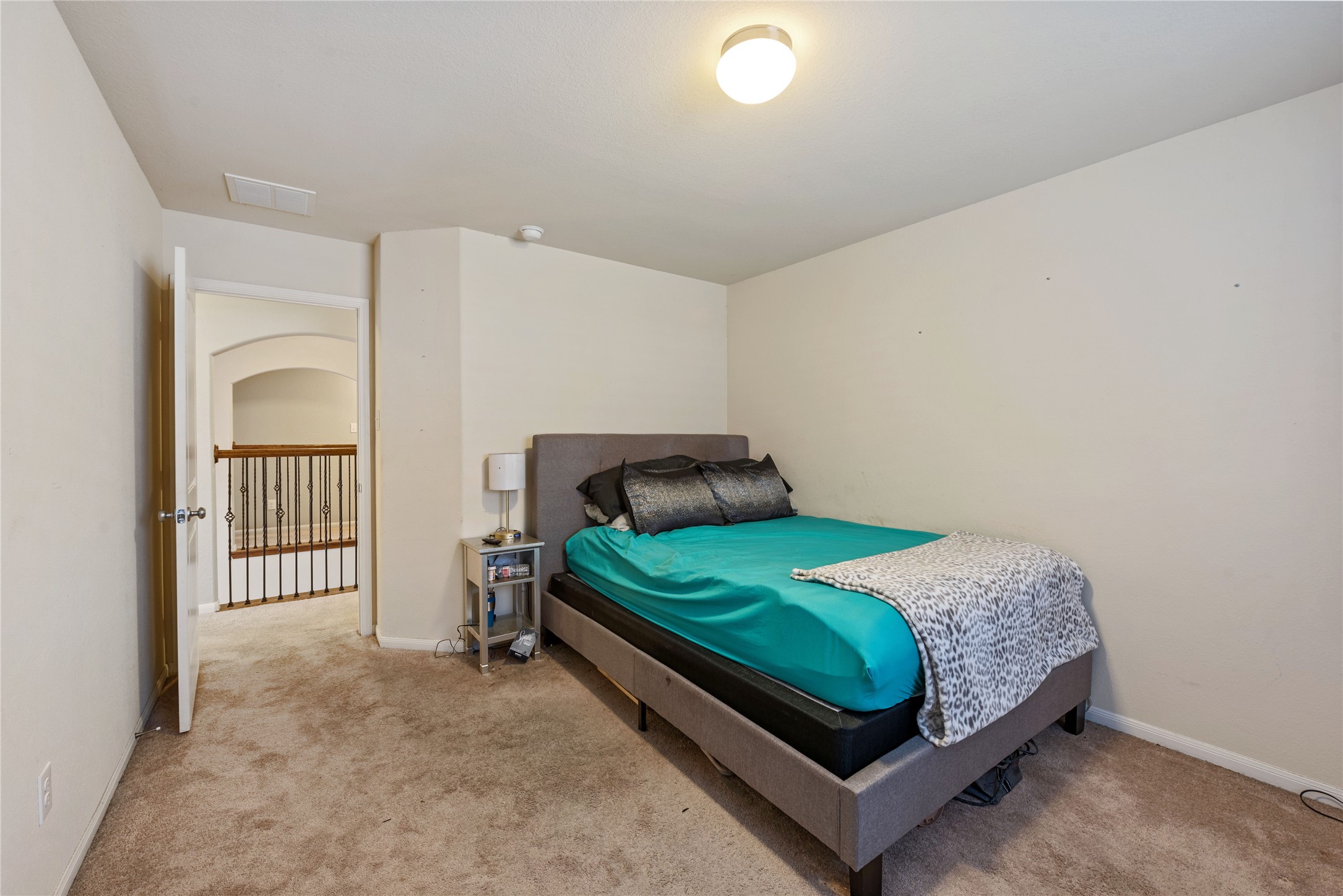 970 Jennifer Street Alvin, TX 77511 - Photo 22 of 27 a bedroom with a bed and a window