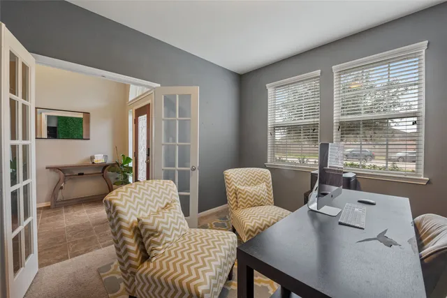 a living room with furniture and a window