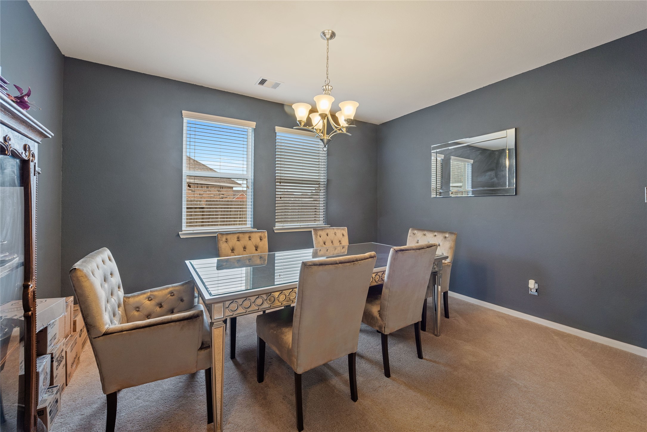 970 Jennifer Street Alvin, TX 77511 - Photo 10 of 27 a view of a dining room with furniture a chandelier and a window