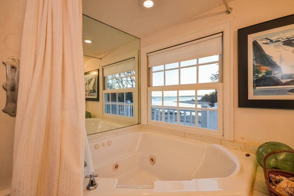 310 A Shore Road Bourne, MA 02532 - Photo 25 of 29 a bathroom with bathtub and window