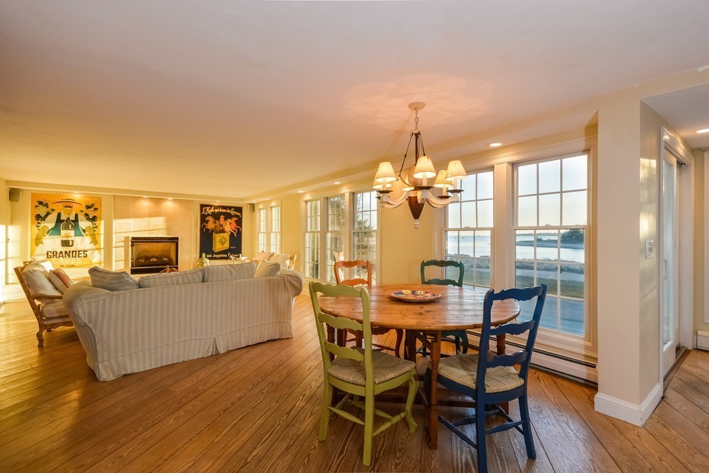 310 A Shore Road Bourne, MA 02532 - Photo 10 of 29 a dining room with furniture a chandelier and wooden floor