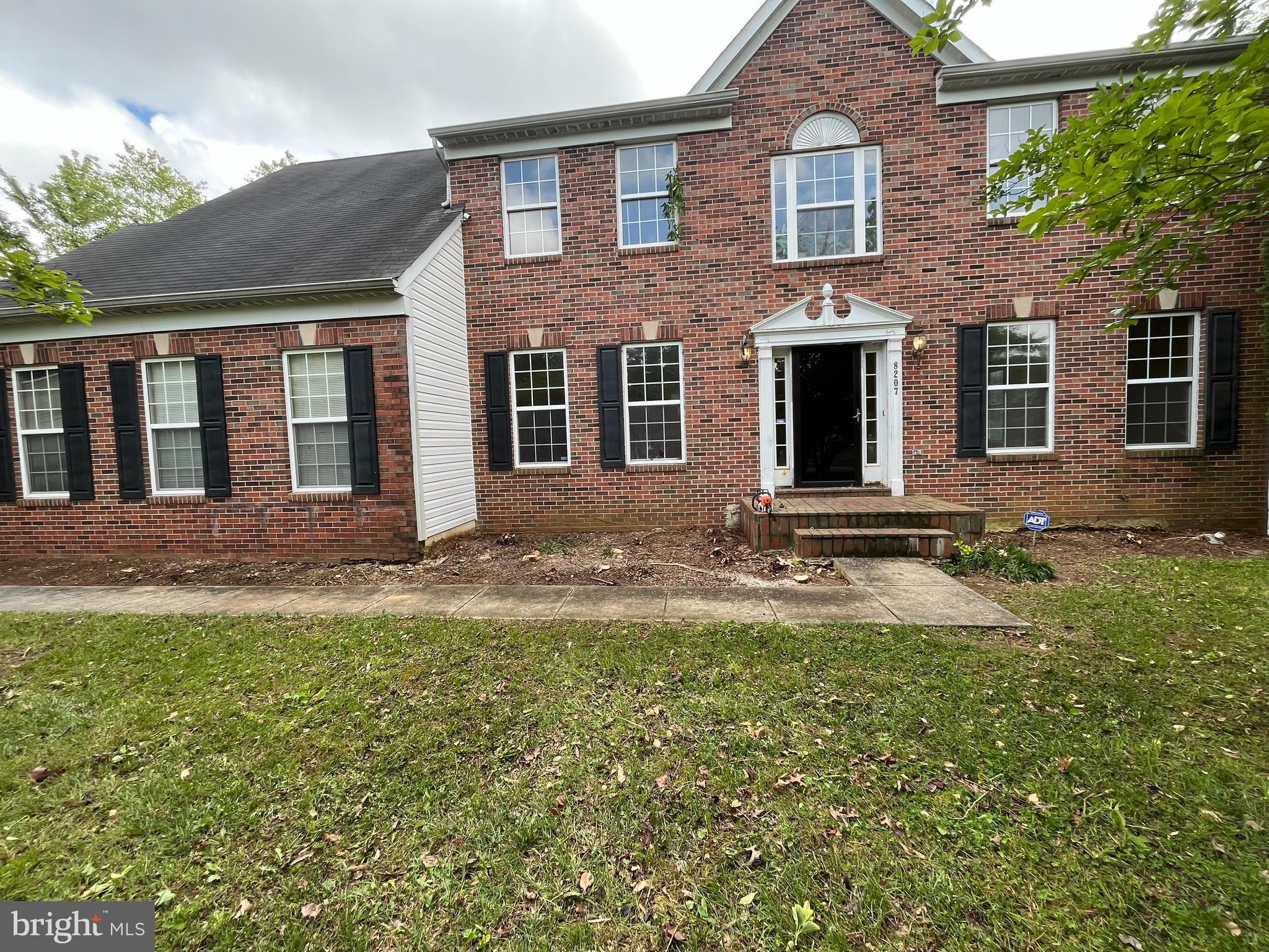8207 Rison Drive Brandywine, MD 20613 - Photo 1 of 31 a backyard of a house with yard table and chairs