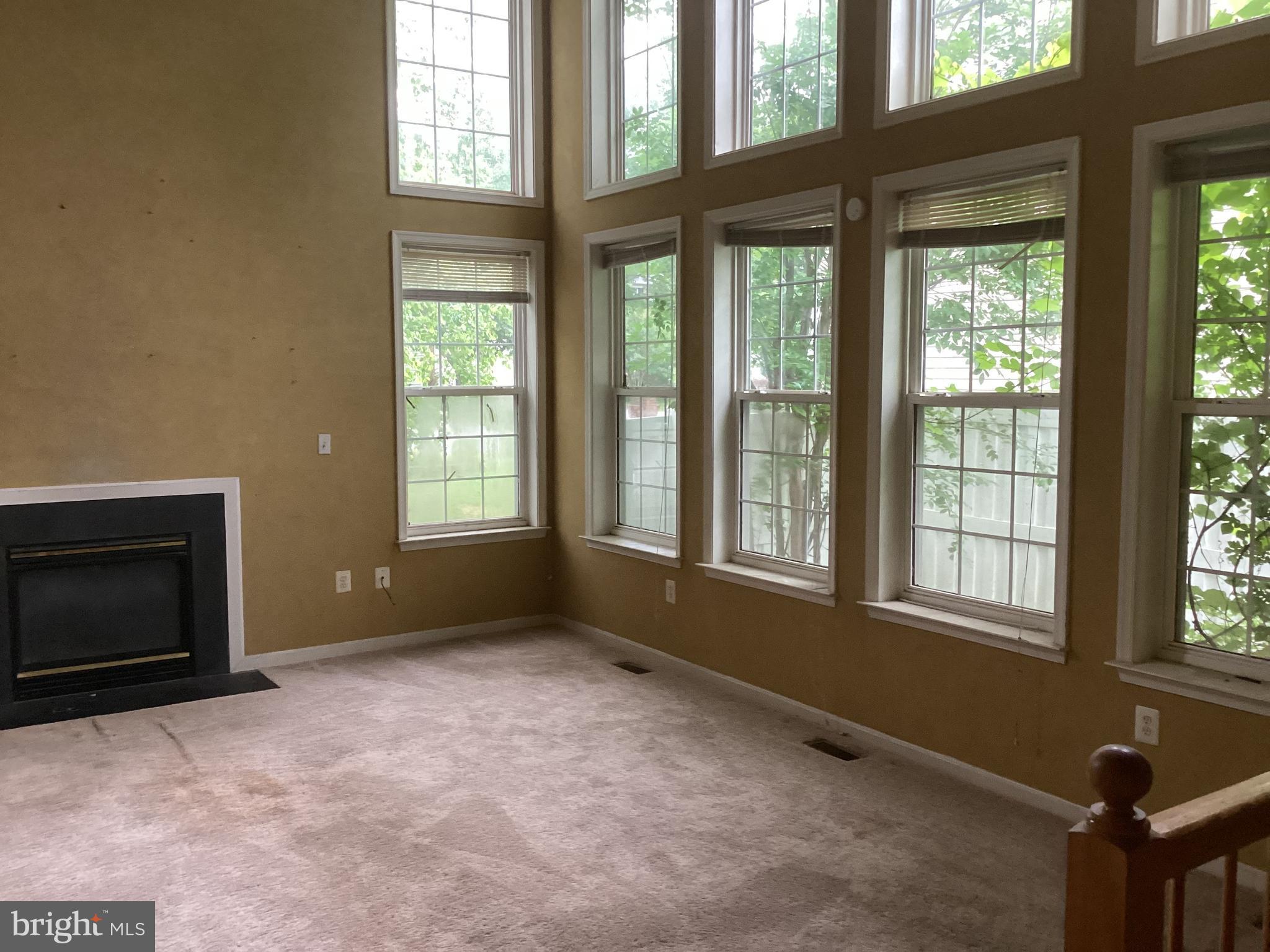 8207 Rison Drive Brandywine, MD 20613 - Photo 11 of 31 a view of an empty room with a window and fire place