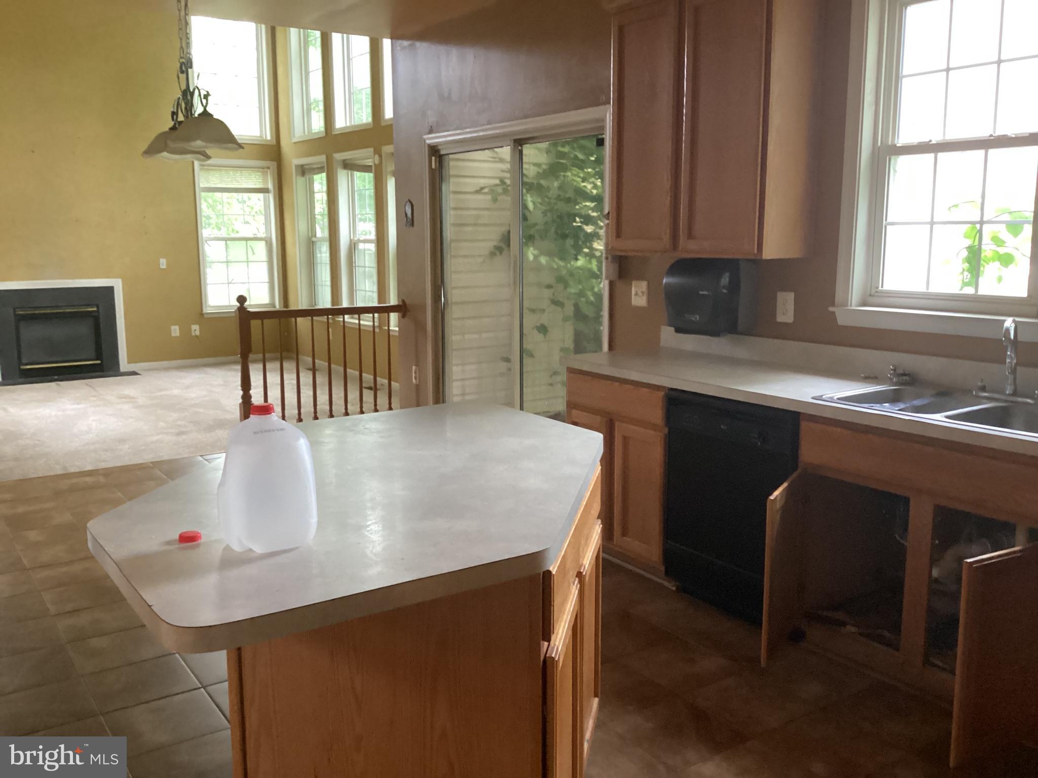 8207 Rison Drive Brandywine, MD 20613 - Photo 14 of 31 a kitchen with a table chairs and a window