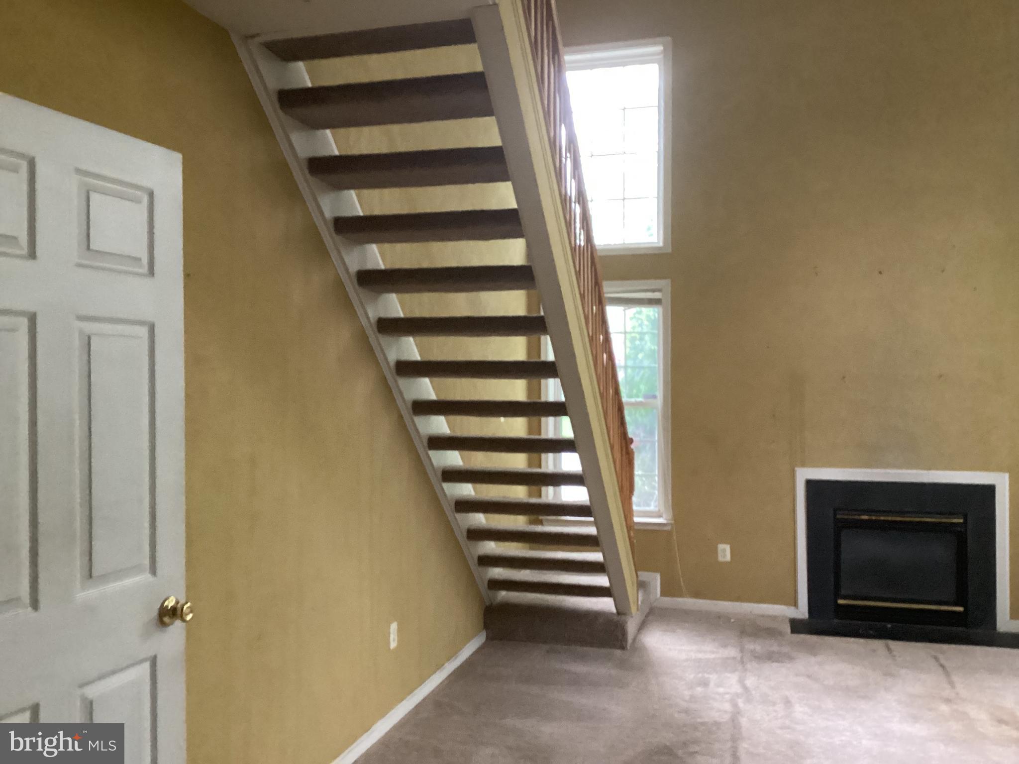 8207 Rison Drive Brandywine, MD 20613 - Photo 20 of 31 a view of a livingroom with stairs and white walls