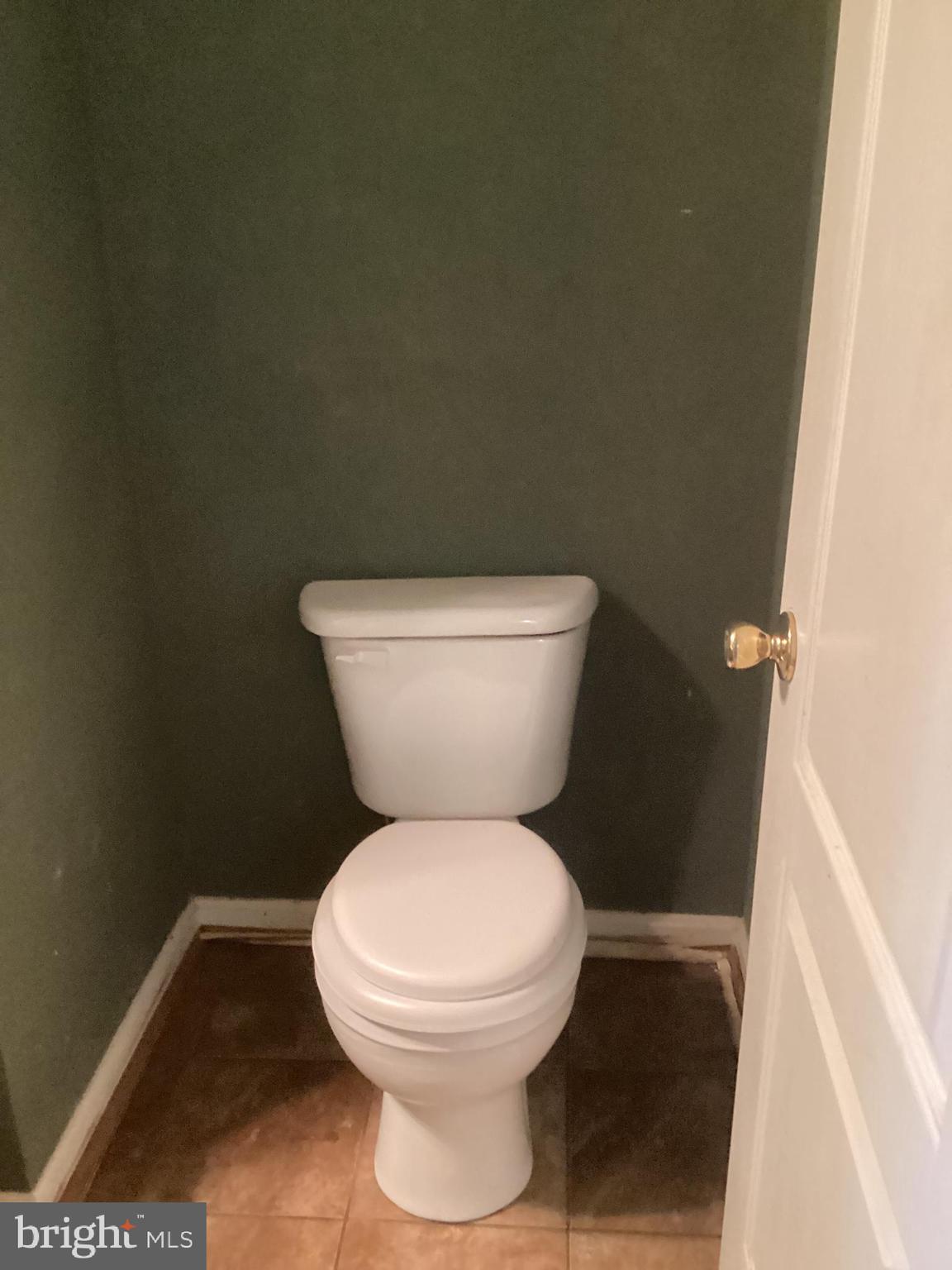 8207 Rison Drive Brandywine, MD 20613 - Photo 27 of 31 a white toilet sitting next to a shower