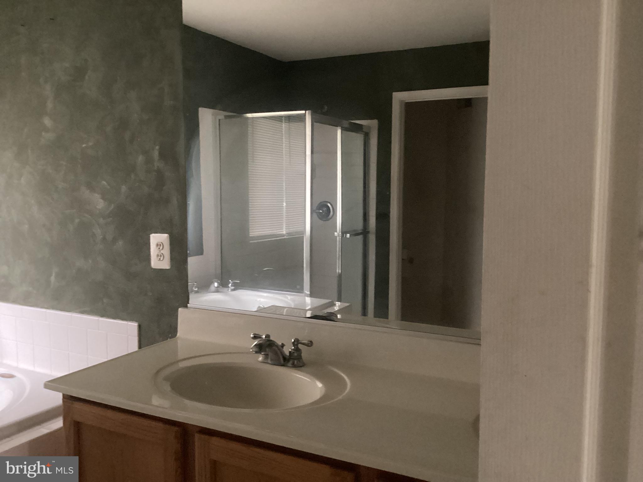 8207 Rison Drive Brandywine, MD 20613 - Photo 28 of 31 a bathroom with a sink and a mirror