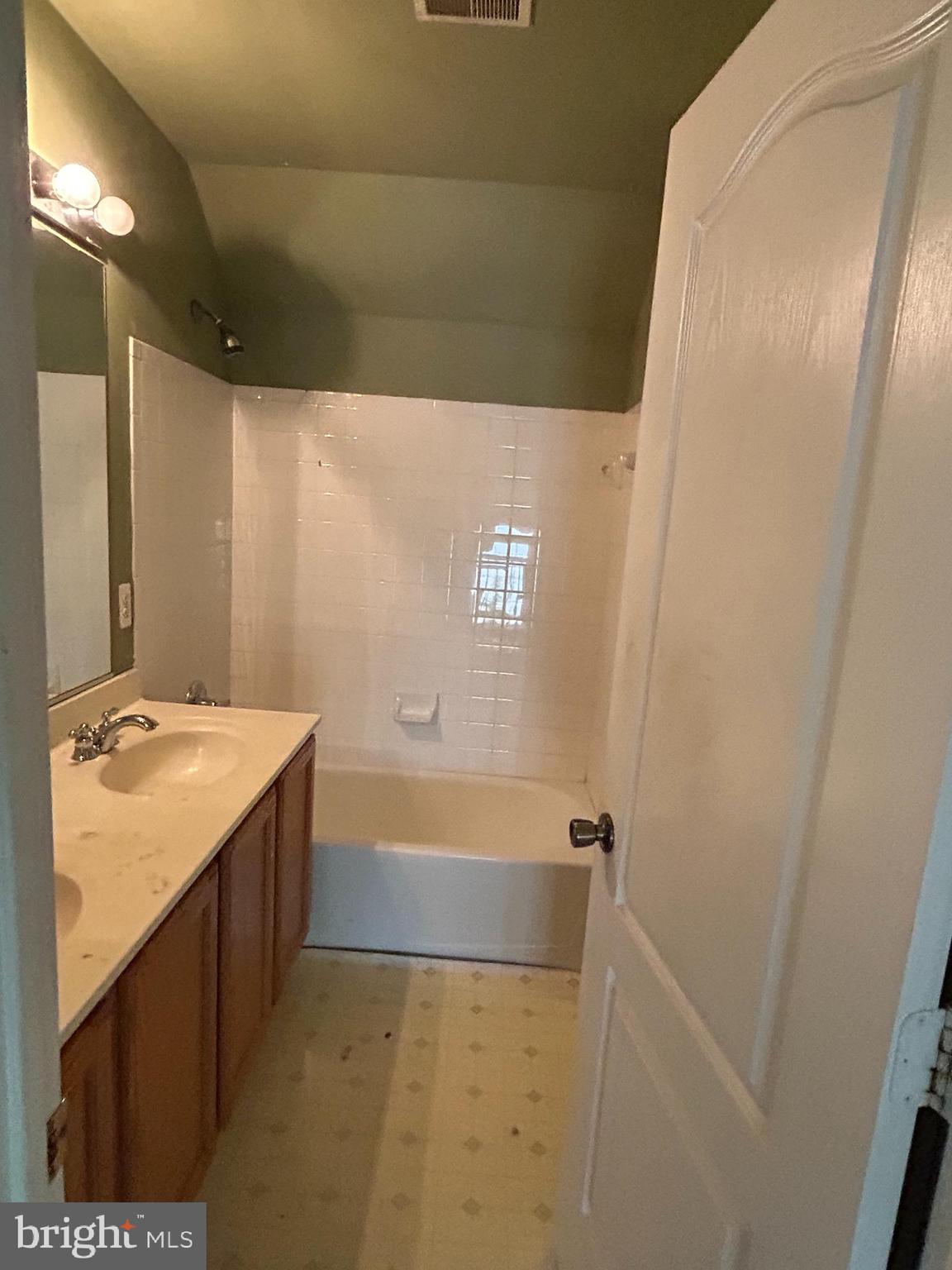 8207 Rison Drive Brandywine, MD 20613 - Photo 4 of 31 a bathroom with a sink and a mirror