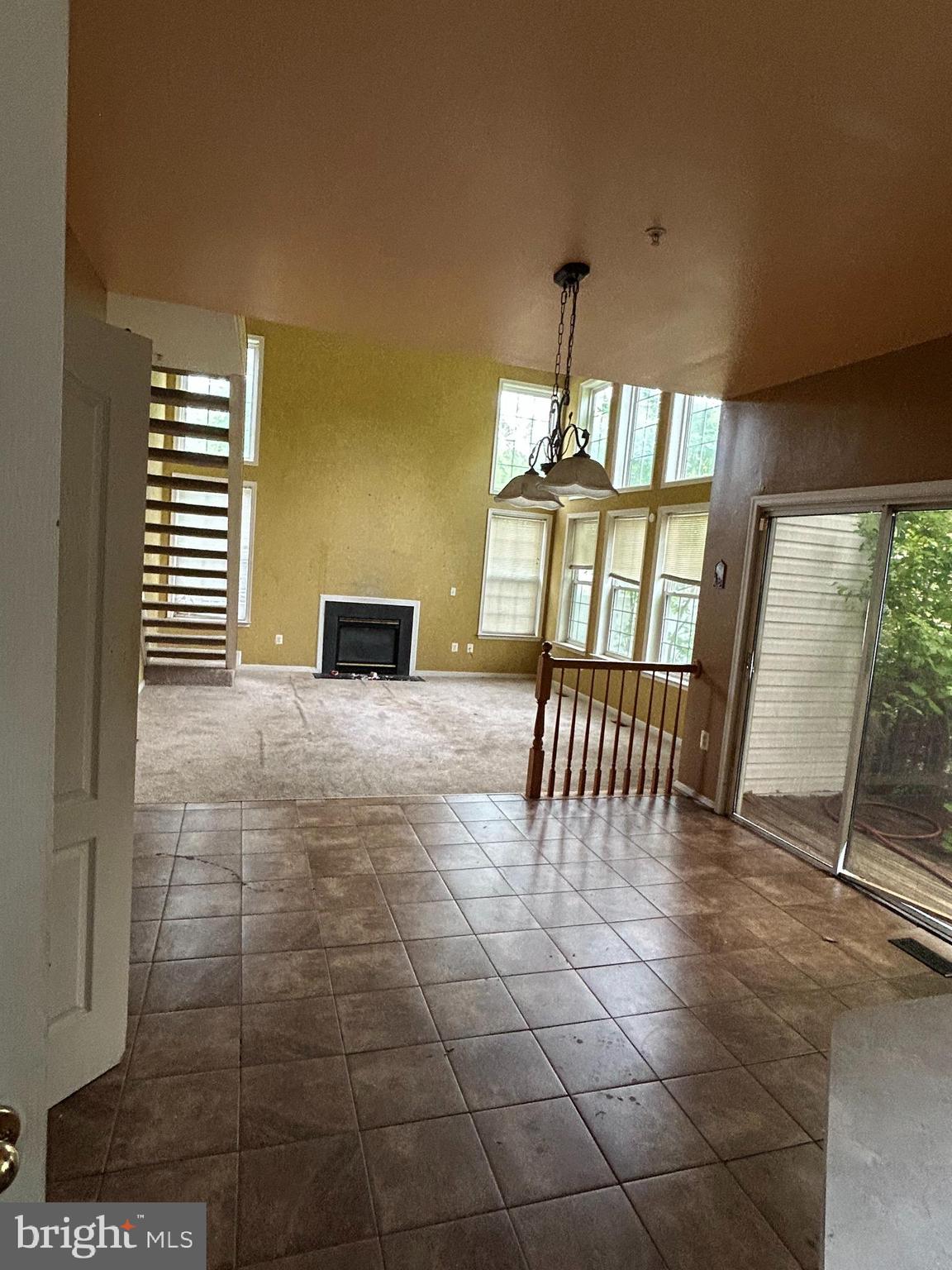 8207 Rison Drive Brandywine, MD 20613 - Photo 9 of 31 a view of an empty room with a fireplace and a window