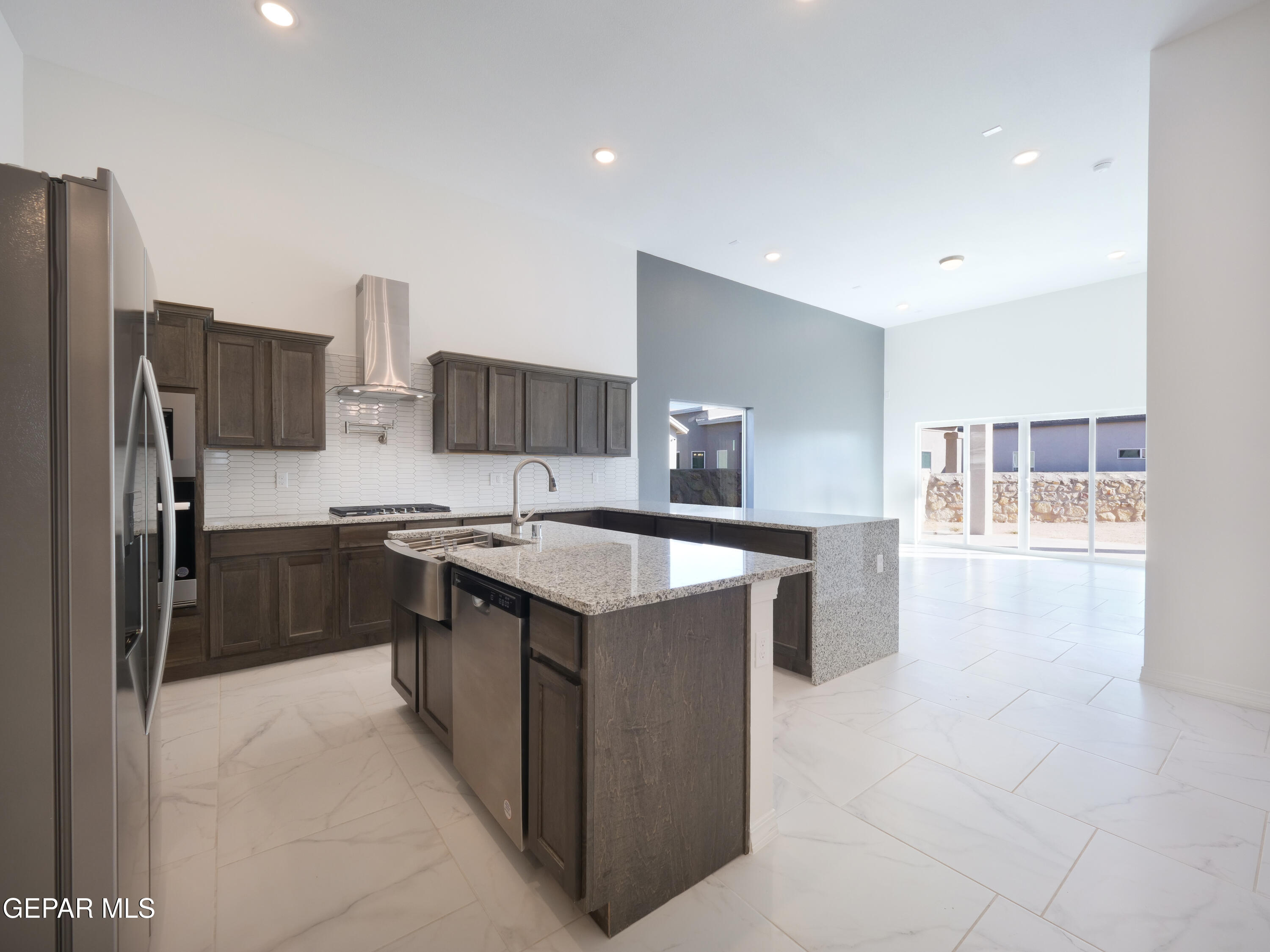 6065 Summer Ridge Santa Teresa, NM 88008 - Photo 2 of 13 a kitchen with stainless steel appliances granite countertop a refrigerator and a sink