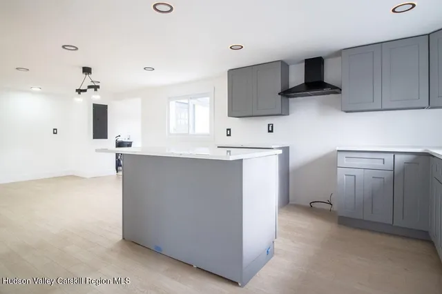 a kitchen with cabinets a sink and appliances