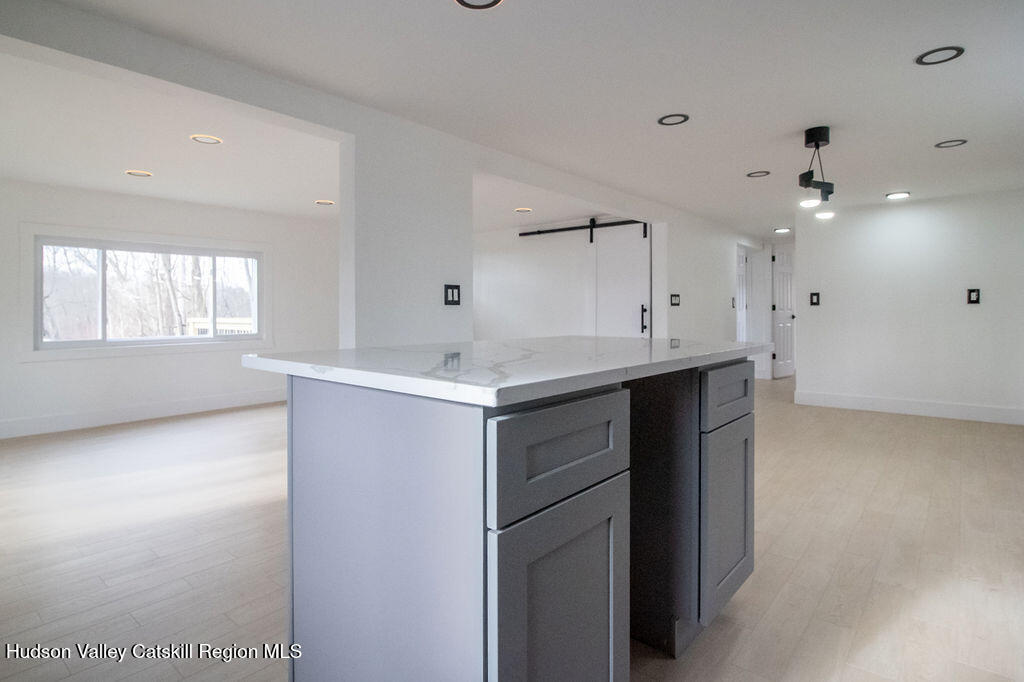 1732 Ulster Heights Road Ellenville, NY 12428 - Photo 19 of 40 a kitchen with a sink cabinets and window