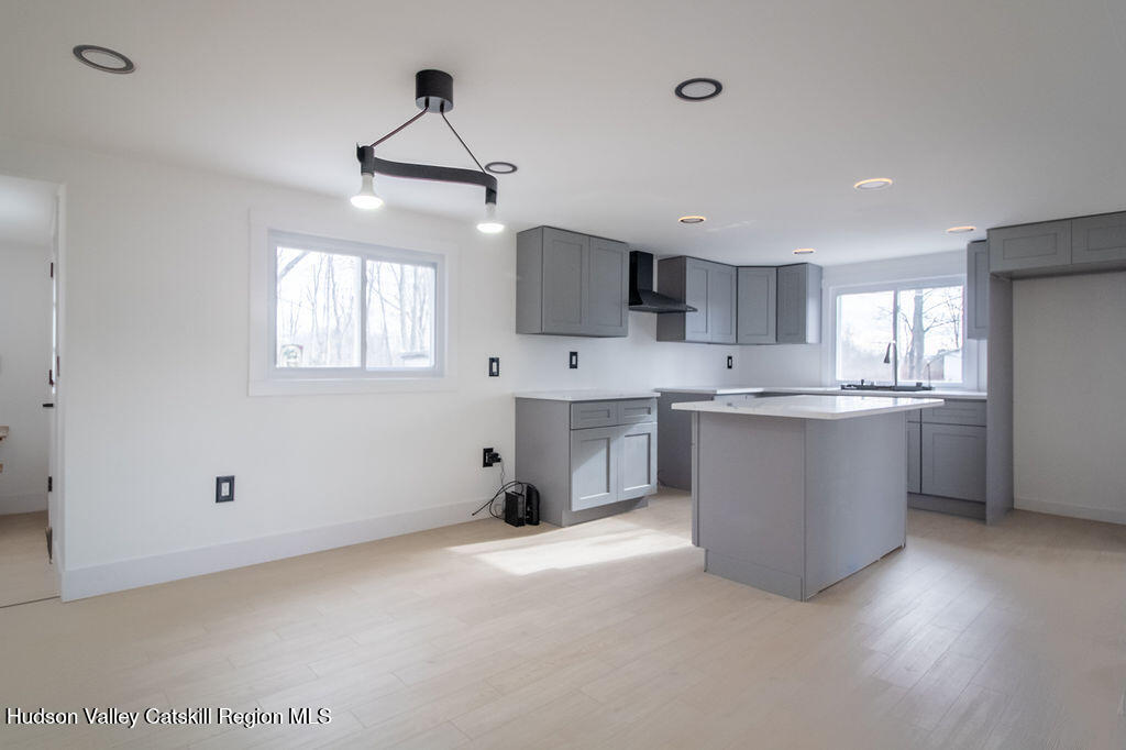 1732 Ulster Heights Road Ellenville, NY 12428 - Photo 20 of 40 a kitchen with kitchen island a sink stainless steel appliances and cabinets