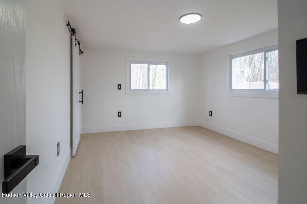 1732 Ulster Heights Road Ellenville, NY 12428 - Photo 28 of 40 an empty room with windows