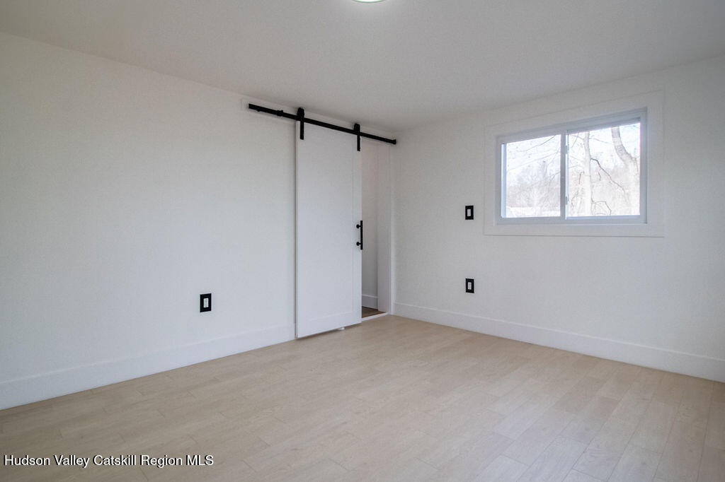 1732 Ulster Heights Road Ellenville, NY 12428 - Photo 30 of 40 a view of an empty room with a window