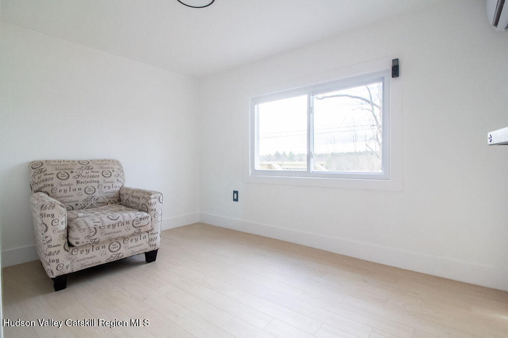 1732 Ulster Heights Road Ellenville, NY 12428 - Photo 39 of 40 a living room with furniture and a window