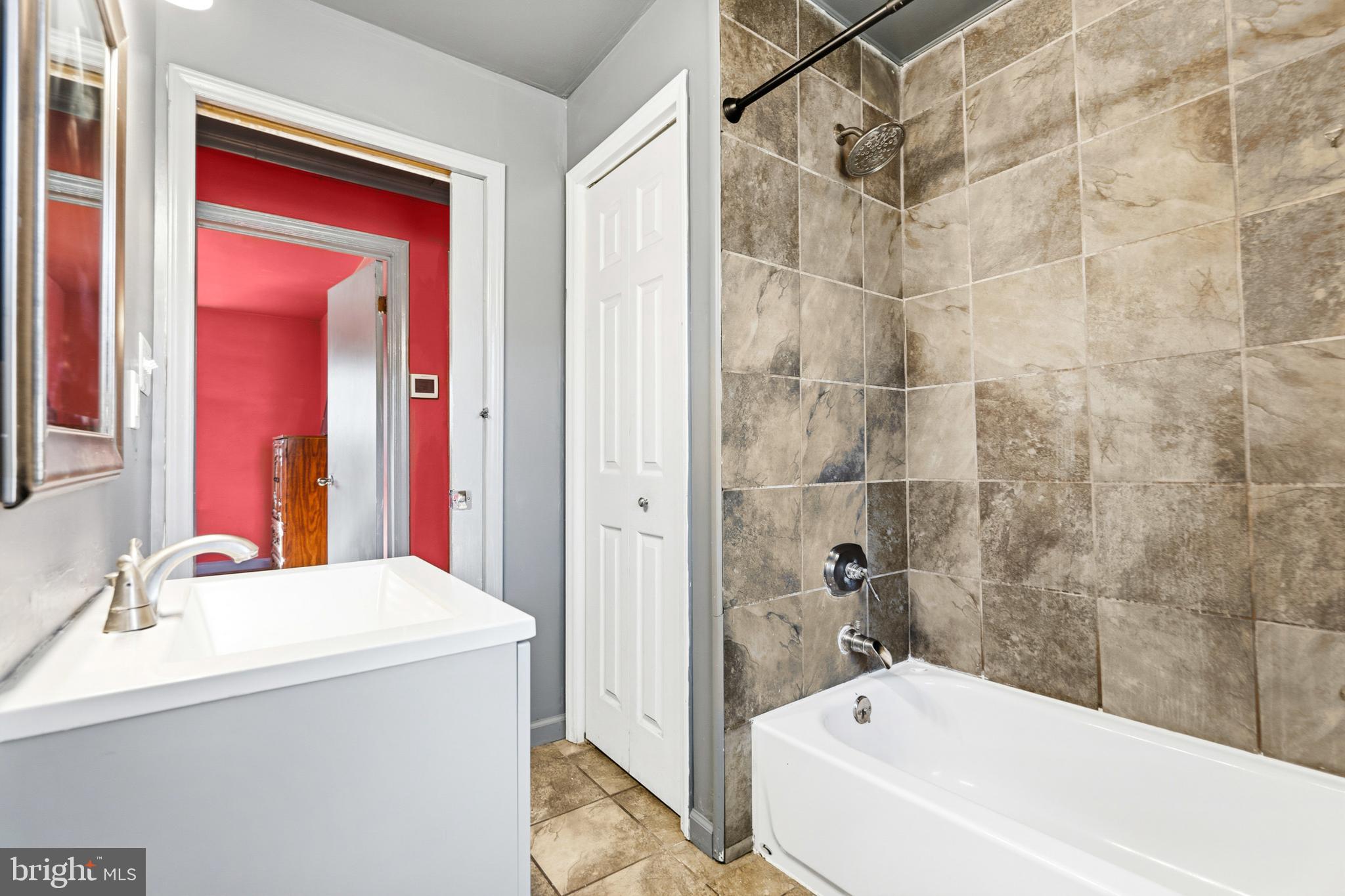 6156 Ripley Road La Plata, MD 20646 - Photo 21 of 26 a bathroom with a sink and a bathtub