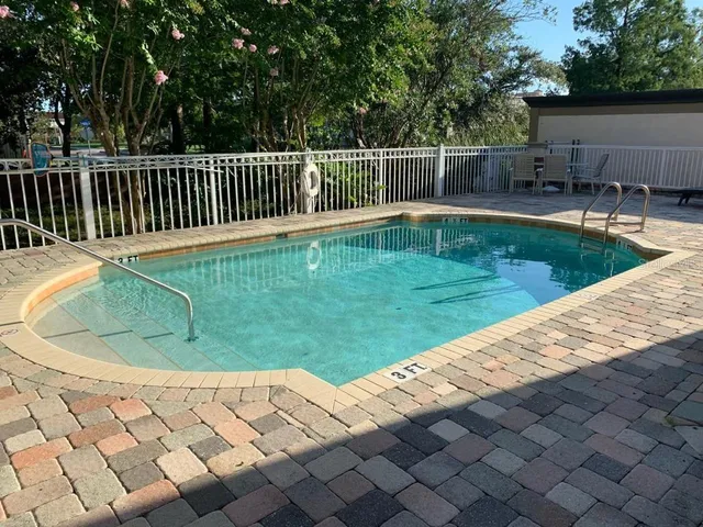 a view of a backyard with a small pool