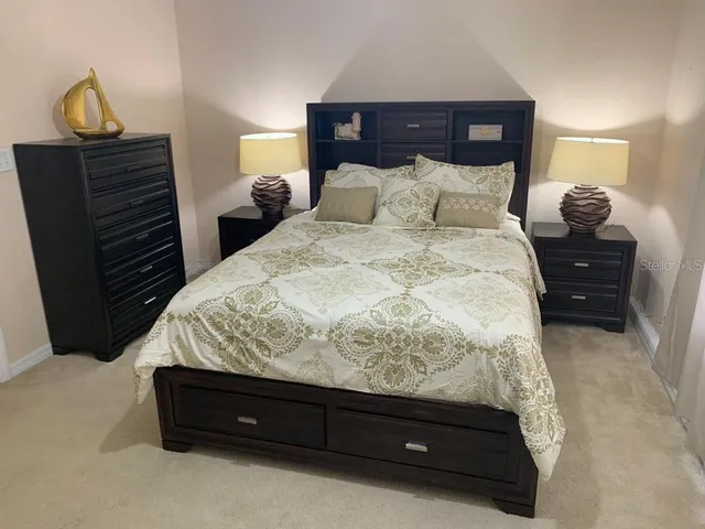 a bedroom with bed and window