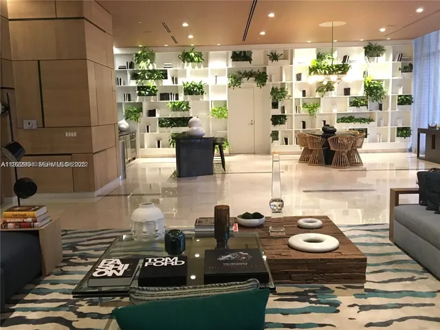 a kitchen with stainless steel appliances granite countertop a stove and a refrigerator