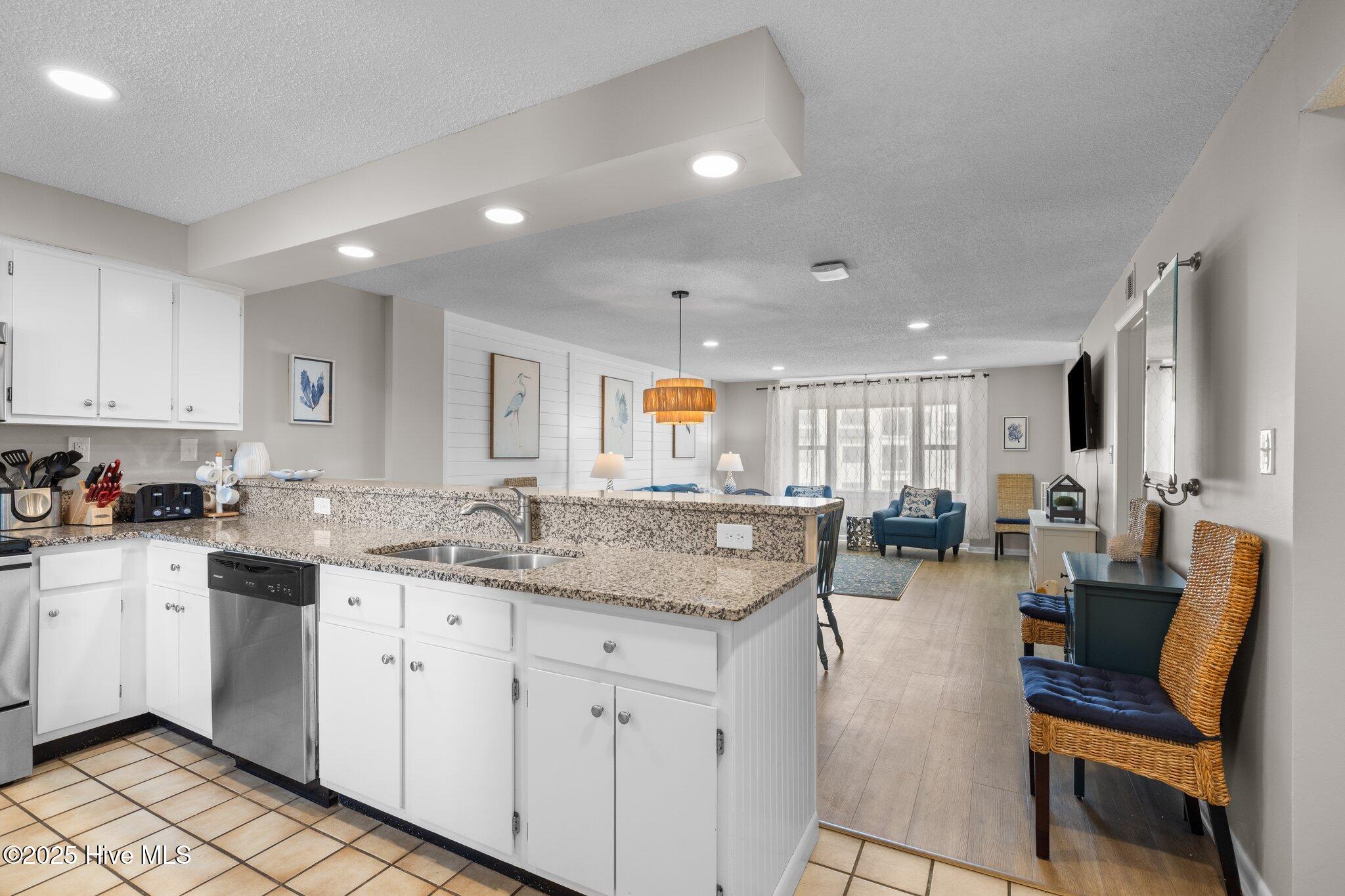 1505 Salter Path Road, Unit 409 Indian Beach, NC 28512 - Photo 13 of 35 Kitchen and Living Space