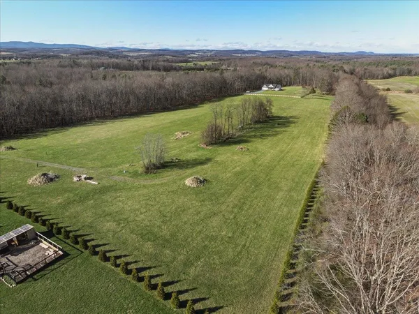 a view of a lake with a yard