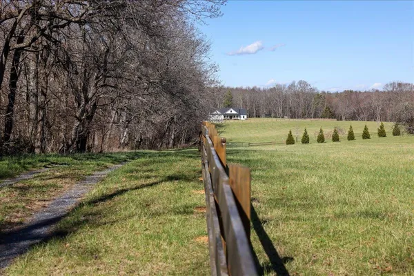 a view of a yard with an outdoor seating