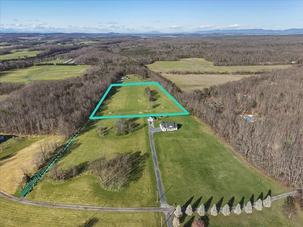 a view of a swimming pool with a yard