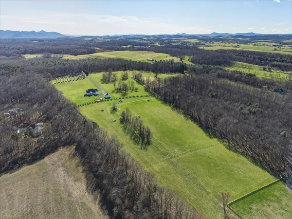 a view of a water pond with a yard