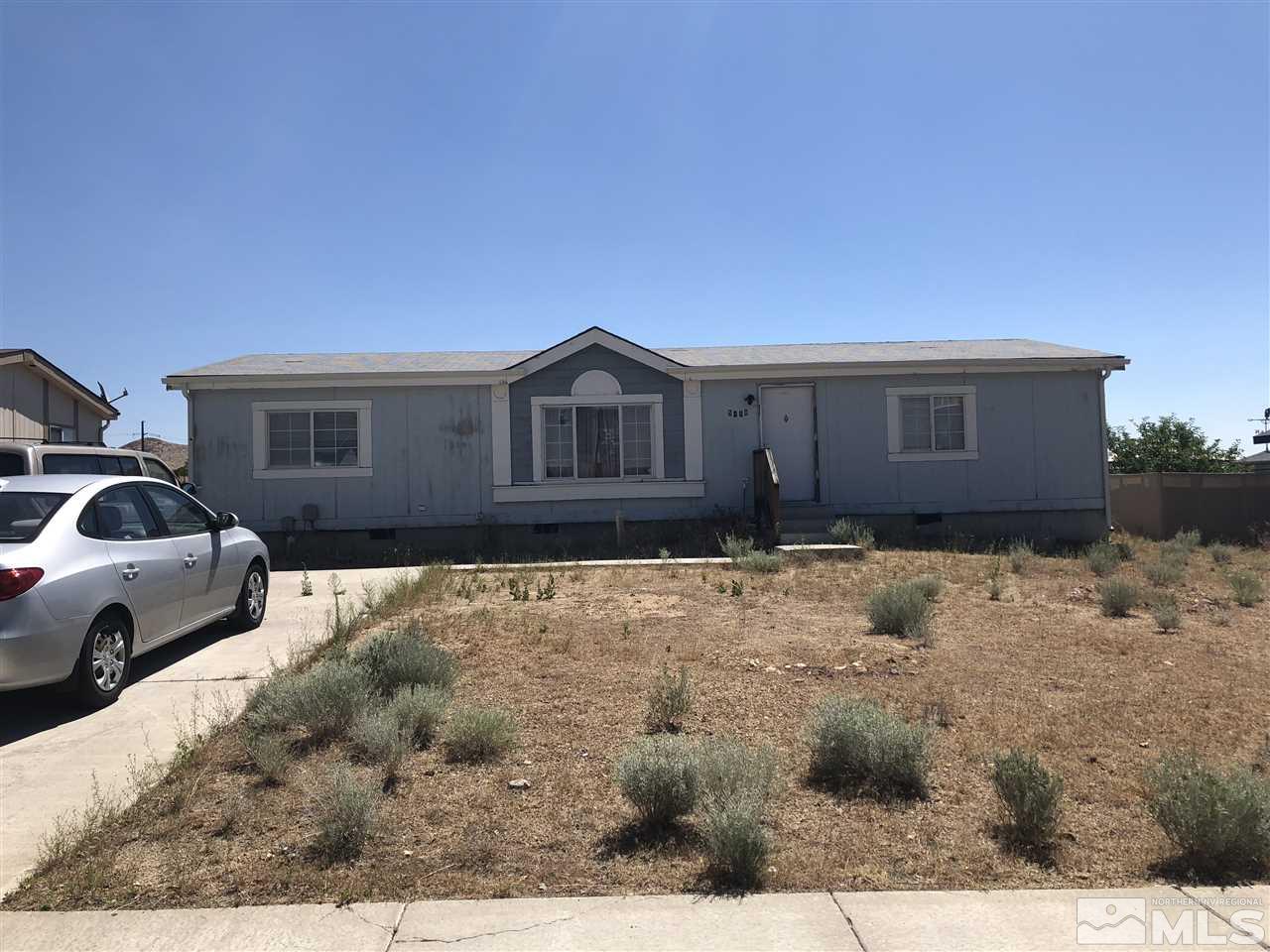 5118 Coggins Road Reno, NV 89506 - Photo 1 of 9 a view of a house with a yard covered in snow