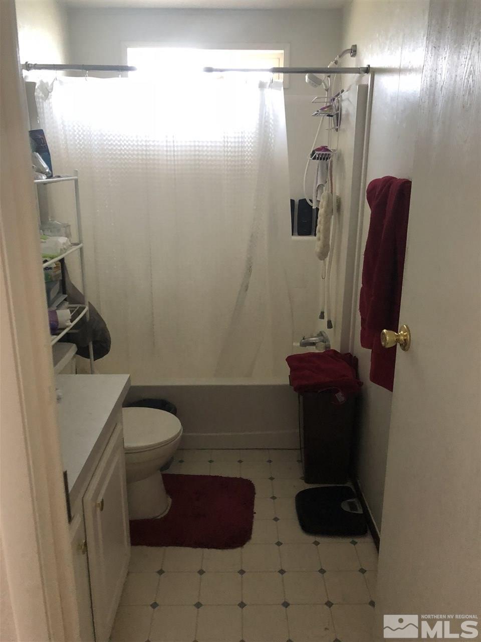 5118 Coggins Road Reno, NV 89506 - Photo 6 of 9 a bathroom with a toilet and a shower