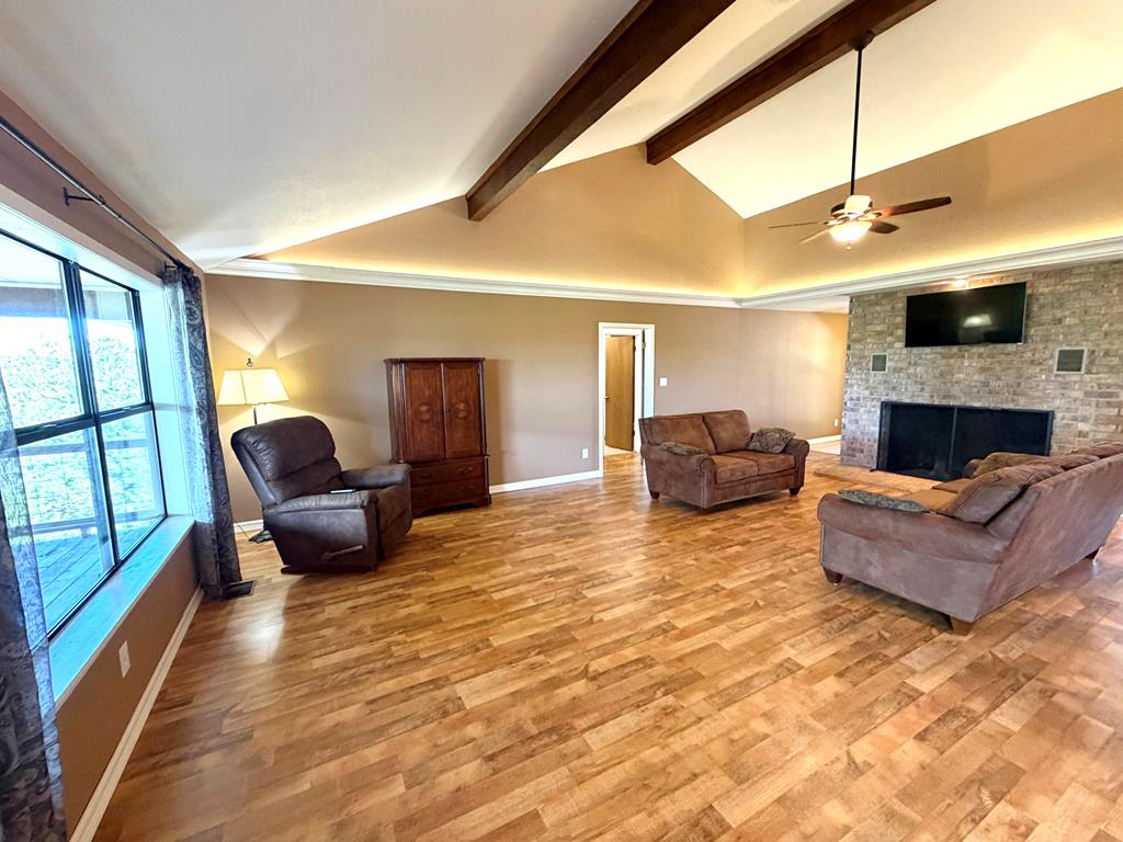 707 Rimrock Road Kerrville, TX 78028 - Photo 9 of 55 a living room with furniture and a fireplace