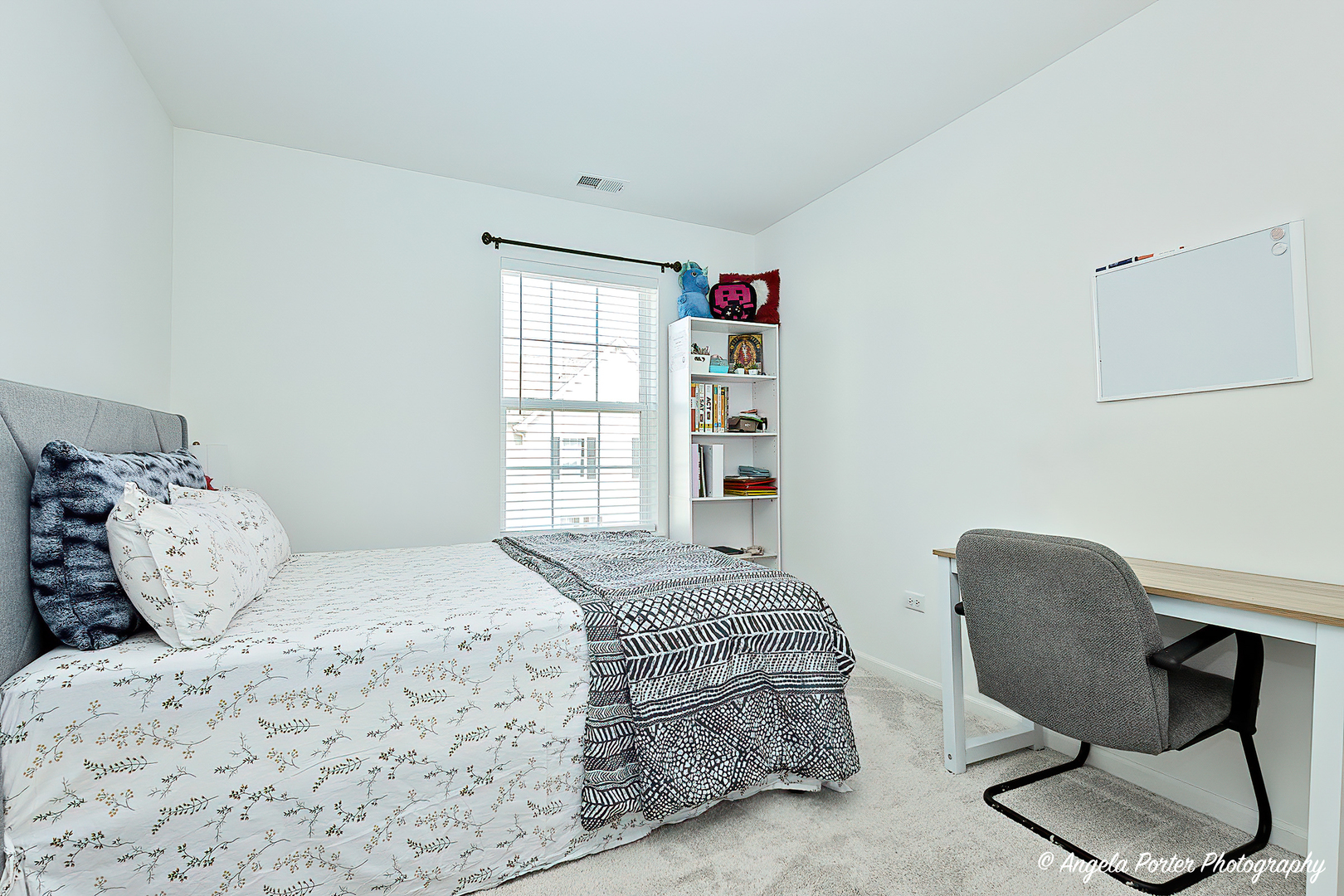 1004 Neubauer Circle Lindenhurst, IL 60046 - Photo 22 of 29 a bedroom with a bed a chair and a window