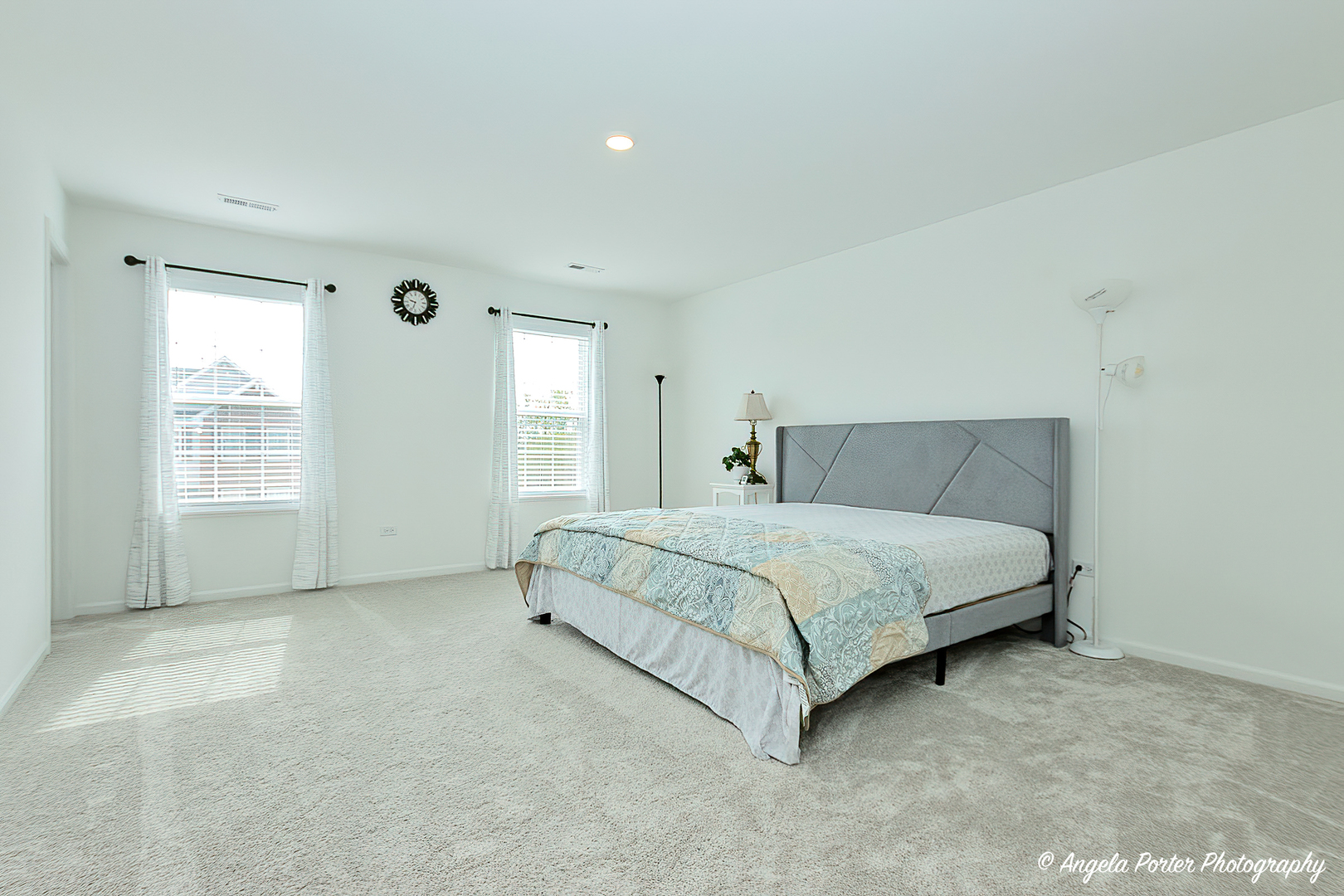 1004 Neubauer Circle Lindenhurst, IL 60046 - Photo 24 of 29 a spacious bedroom with a bed and a window
