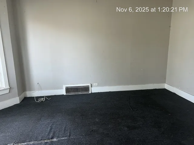 an empty room with wooden floor