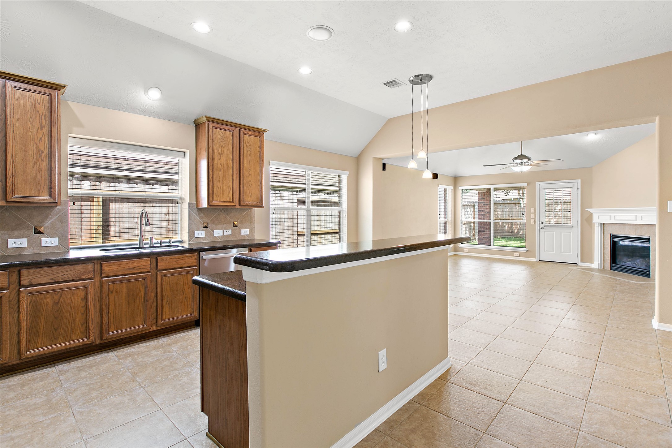 30411 Deleon Fields Drive Spring, TX 77386 - Photo 7 of 24 Heart of the home kitchen, featuring updated finishes and an open concept design overlooking the main living space.