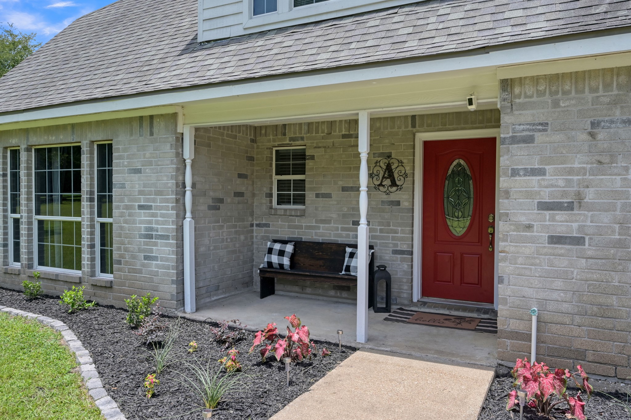 Inviting covered front porch offers the perfect spot to welcome guests to your new home