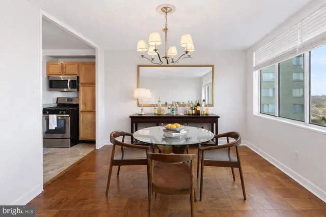 a view of a dining room with furniture and wooden floor