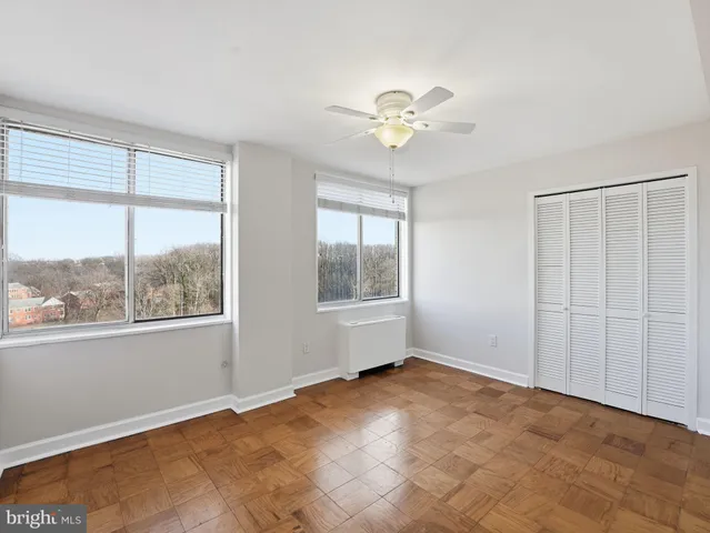 a view of an empty room with a window
