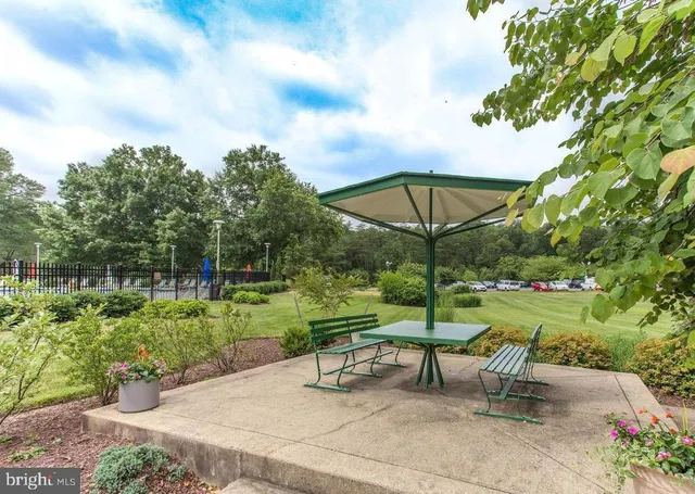 a view of a bench in a garden
