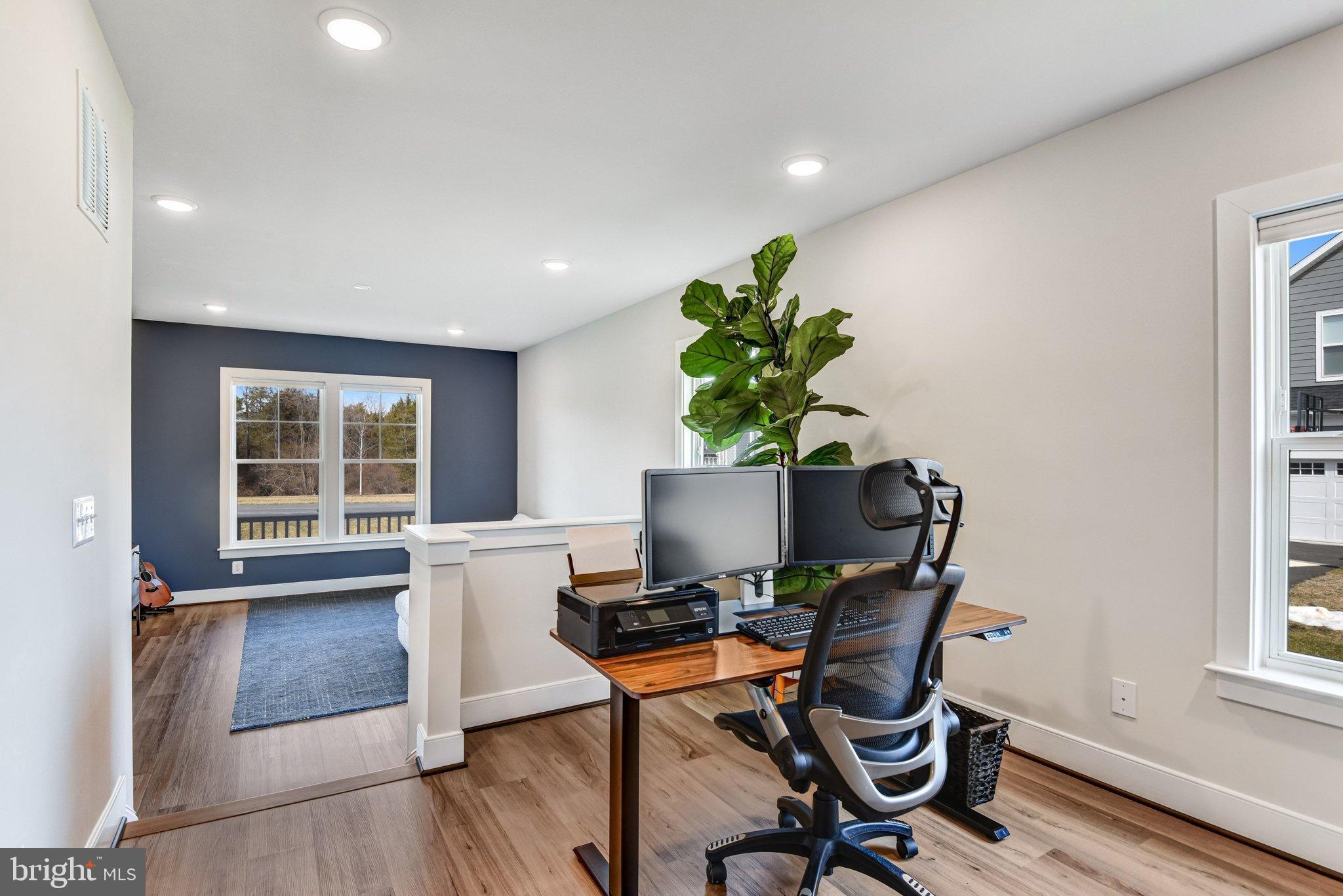 43199 Dogan Rdg Place Centreville, VA 20120 - Photo 17 of 86 a view of a workspace with furniture and a window