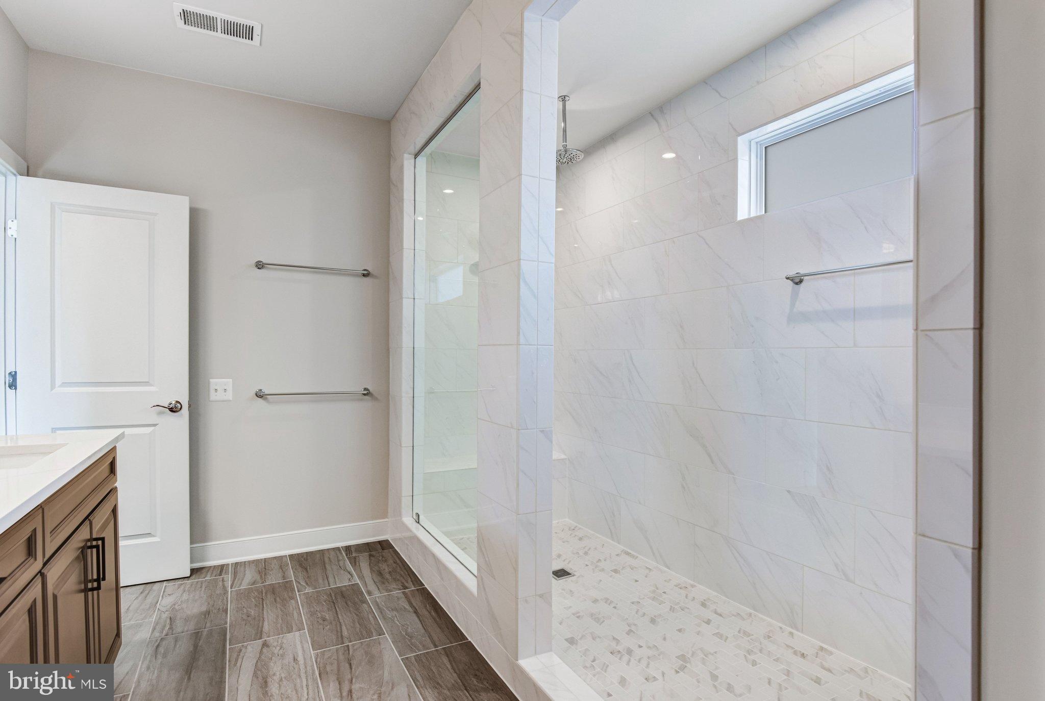 43199 Dogan Rdg Place Centreville, VA 20120 - Photo 41 of 86 Sleek modern bathroom with spacious shower.