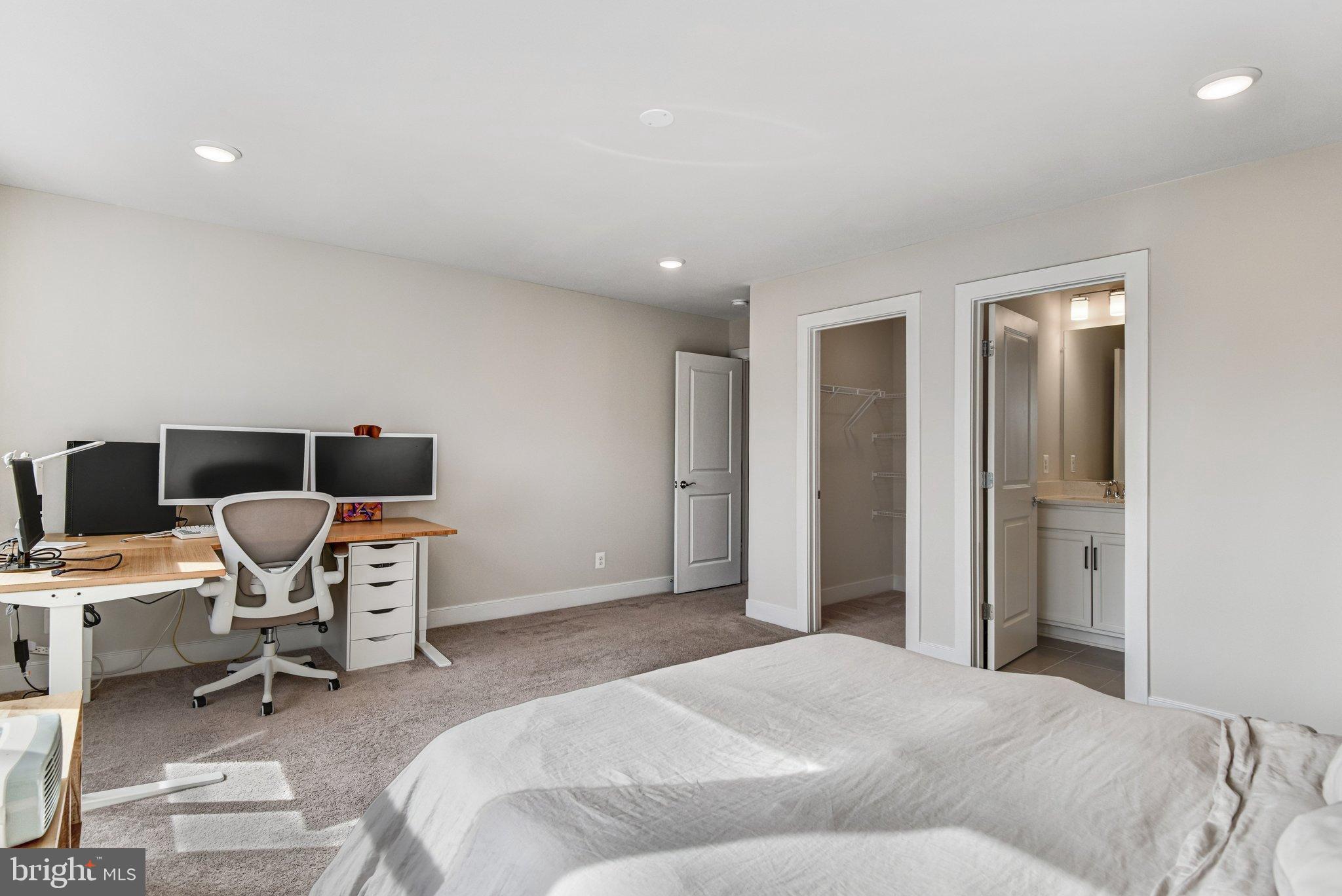 43199 Dogan Rdg Place Centreville, VA 20120 - Photo 46 of 86 a bedroom with a bed and a chair