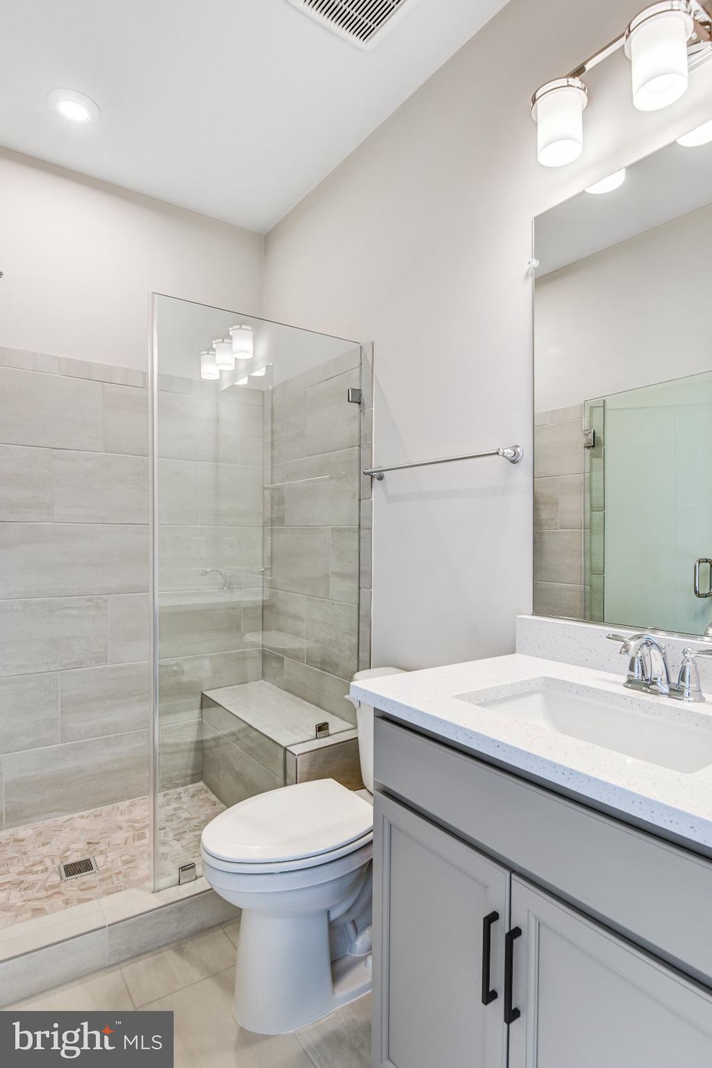 43199 Dogan Rdg Place Centreville, VA 20120 - Photo 51 of 86 a bathroom with a sink a toilet and shower